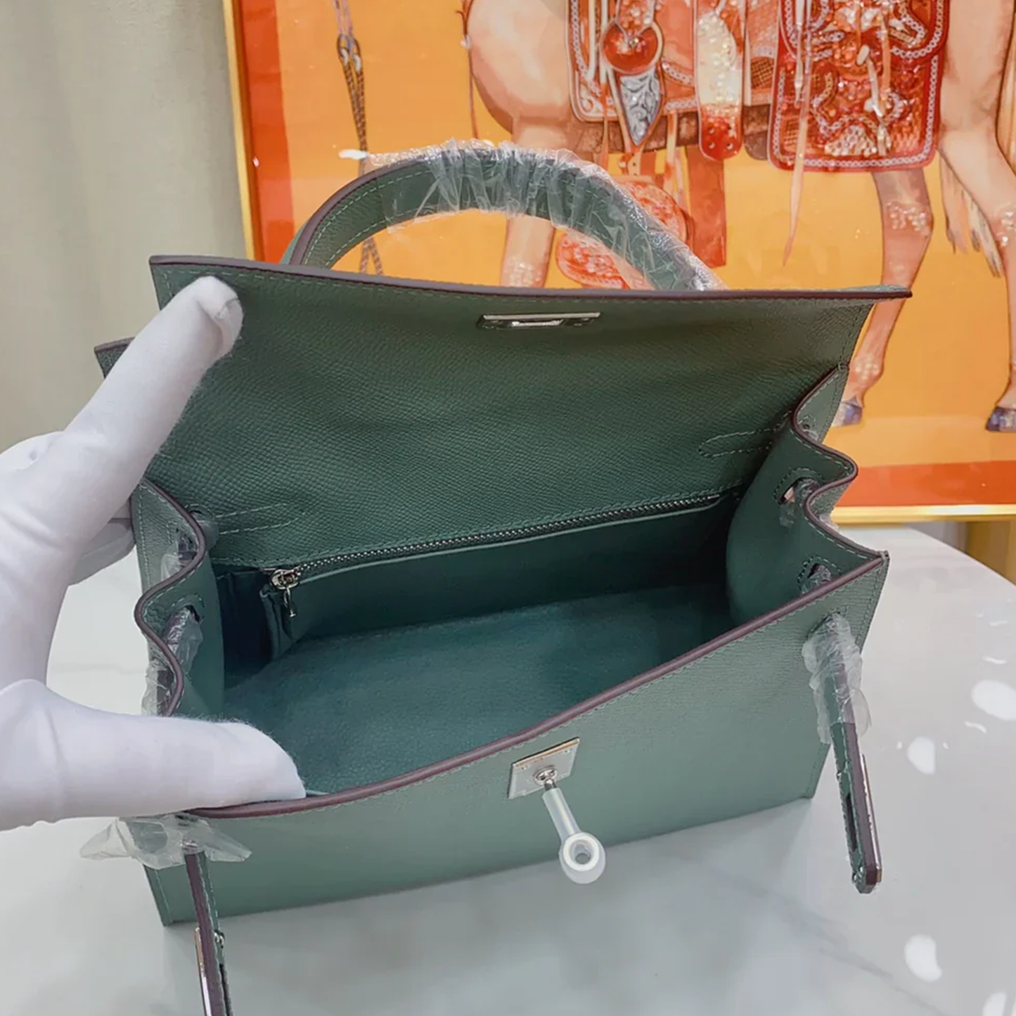 Muted Forest Green Contrast Handle Compact Rectangular Hand Bag With Sleek Silvery Twist Lock Hardware And Fine Defined Grain Detailing