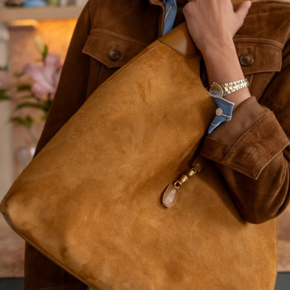 Warm Vintage Camel Spacious Slouchy Hobo Tote With Curved Shoulder Strap And Sculpted Golden Metallic Tab Accent