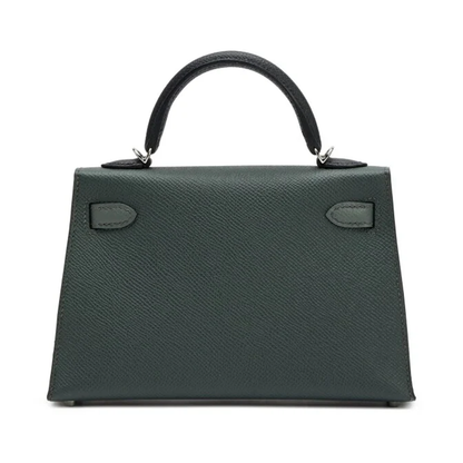 Muted Forest Green Contrast Handle Compact Rectangular Hand Bag With Sleek Silvery Twist Lock Hardware And Fine Defined Grain Detailing